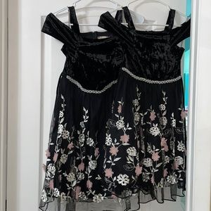 Specklers black girl dress with flower embroidered.